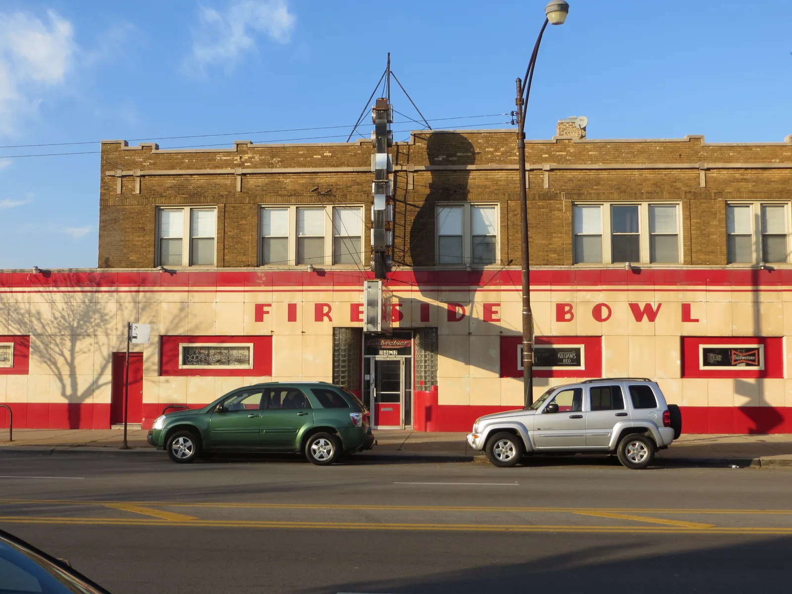 The Fireside Bowl brick facade, painted name, and glass-block entrance on Fullerton Avenue