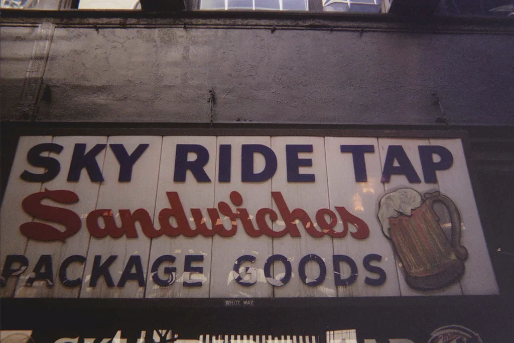 The vintage Sky Ride Tap sandwiches and package-goods sign
