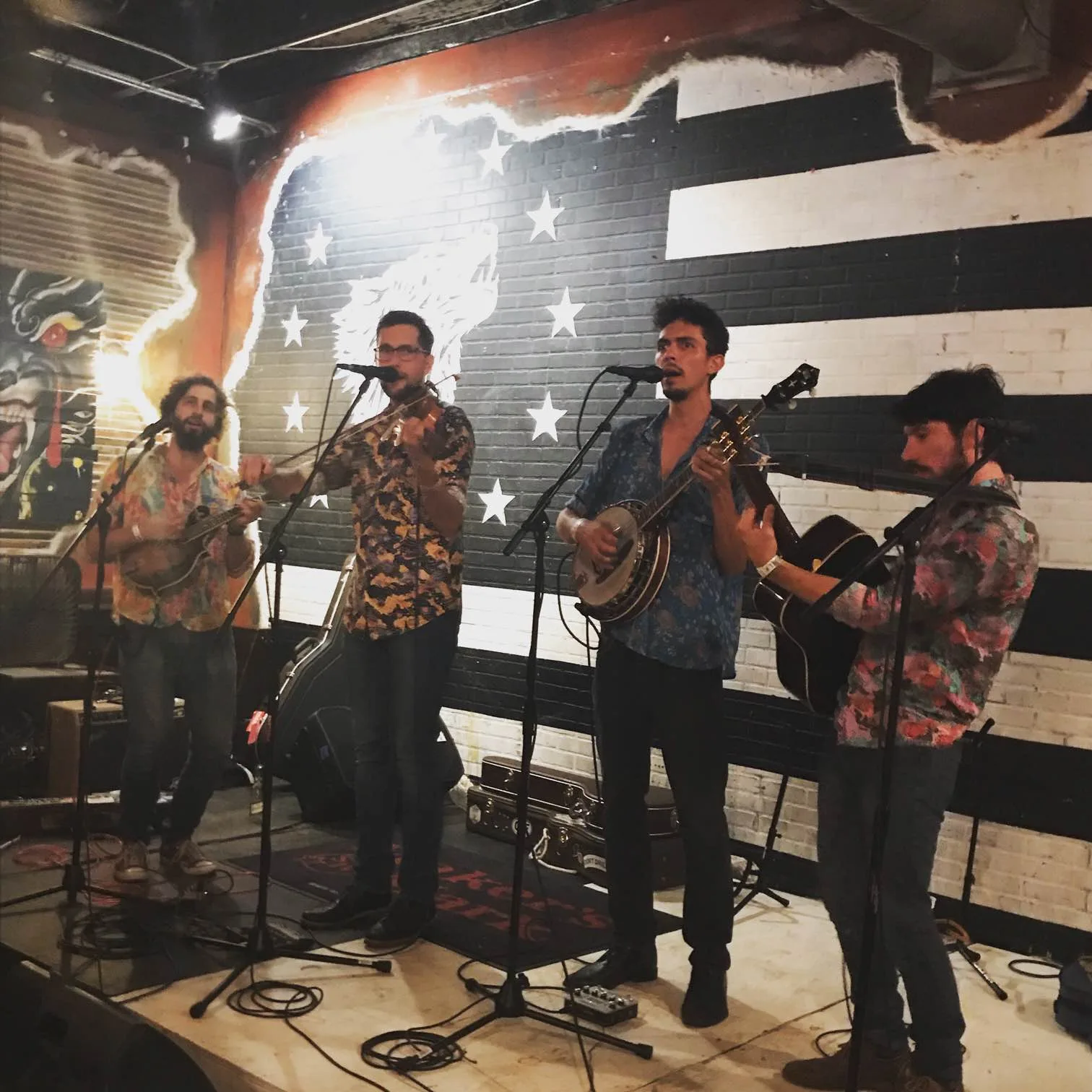 Che Apalache performing at The Crying Wolf in Nashville on September 12, 2019, with a fiddler and guitarist on a small stage