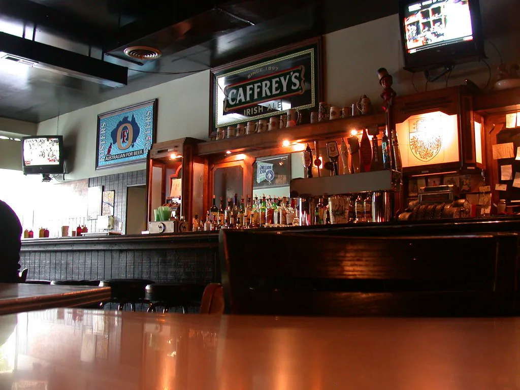 The bar rail inside Jimmy's Woodlawn Tap